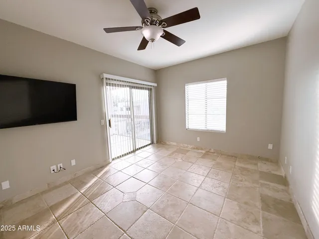 a view of an empty room with a flat screen tv