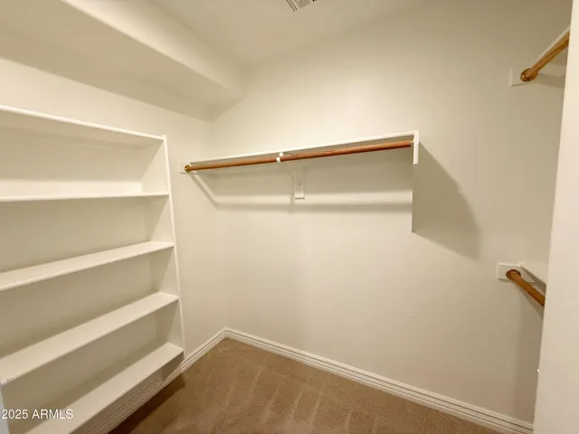 a view of an empty walk in closet