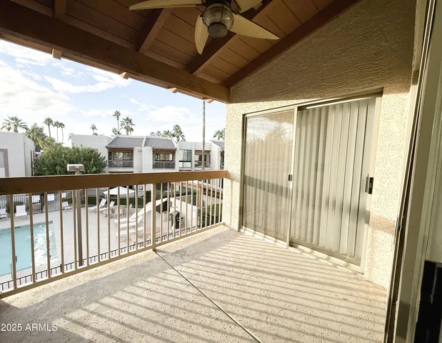 a view of a balcony with wooden floor