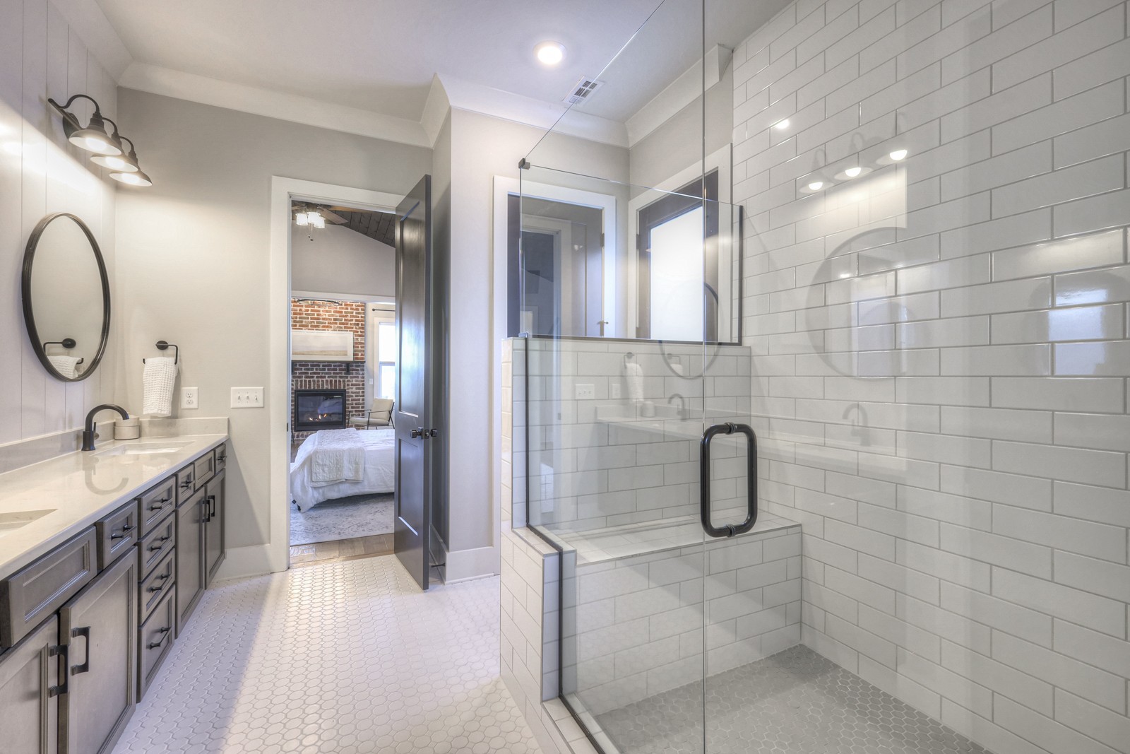 6929 Cross Keys Road College Grove, TN 37046 - Photo 23 of 72 a en suite bathroom with a double vanity sink a toilet a mirror and shower