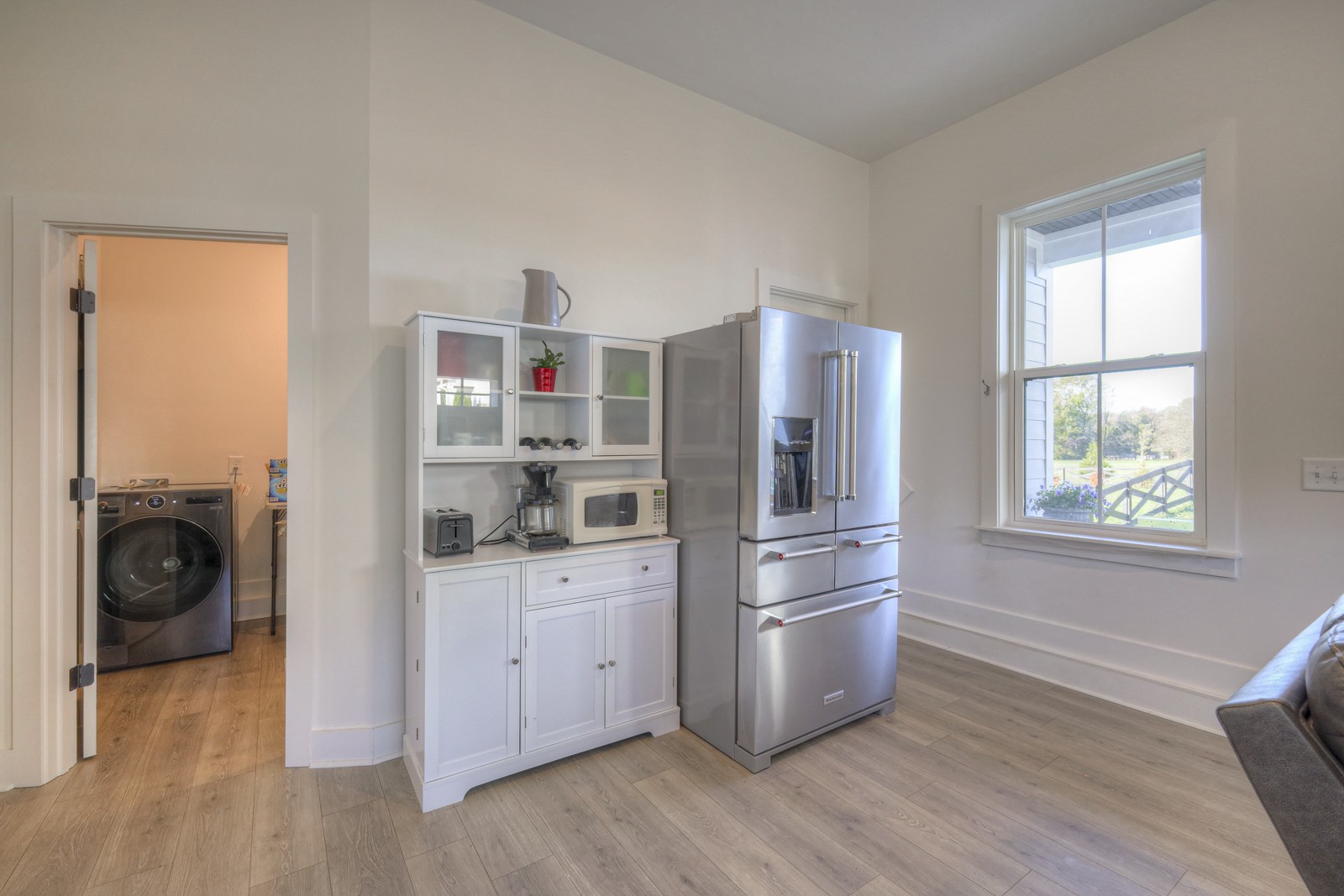 6929 Cross Keys Road College Grove, TN 37046 - Photo 49 of 72 a kitchen with stainless steel appliances a refrigerator and wooden floor