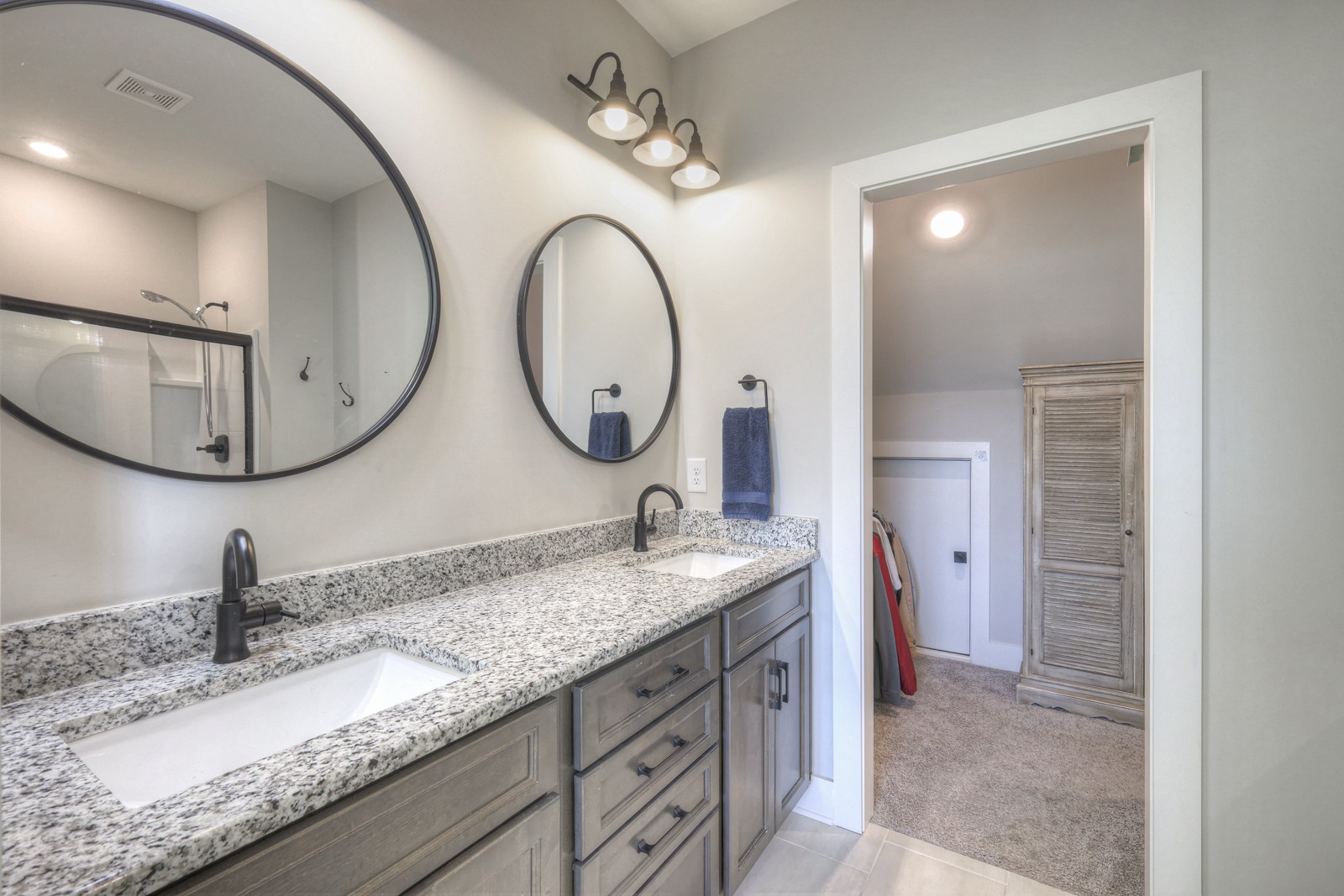 6929 Cross Keys Road College Grove, TN 37046 - Photo 60 of 72 a bathroom with a granite countertop double vanity sinks and a mirror