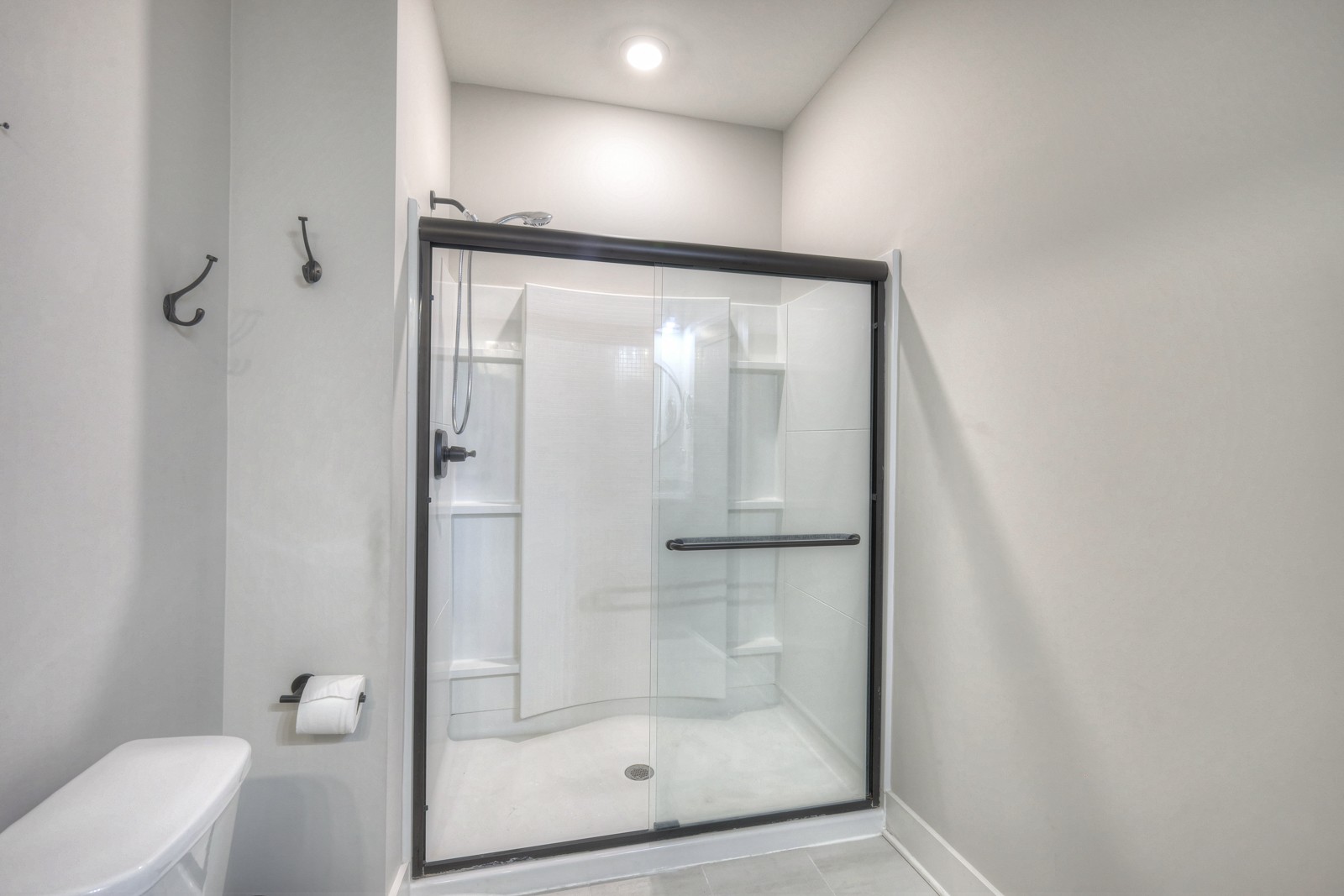 6929 Cross Keys Road College Grove, TN 37046 - Photo 61 of 72 a bathroom with a glass shower door