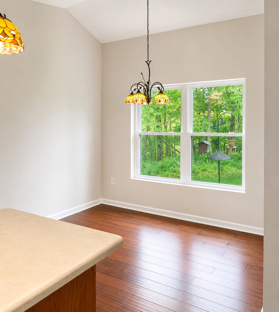1002 2nd St Court Moline, IL 61265 - Photo 10 of 31 a room with window and wooden floor