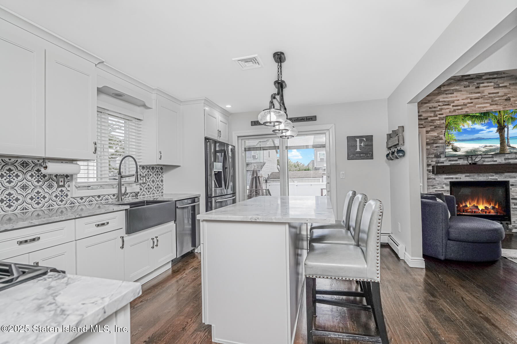 26 Rochelle Place Staten Island, NY 10312 - Photo 16 of 47 a kitchen with granite countertop a sink appliances and cabinets