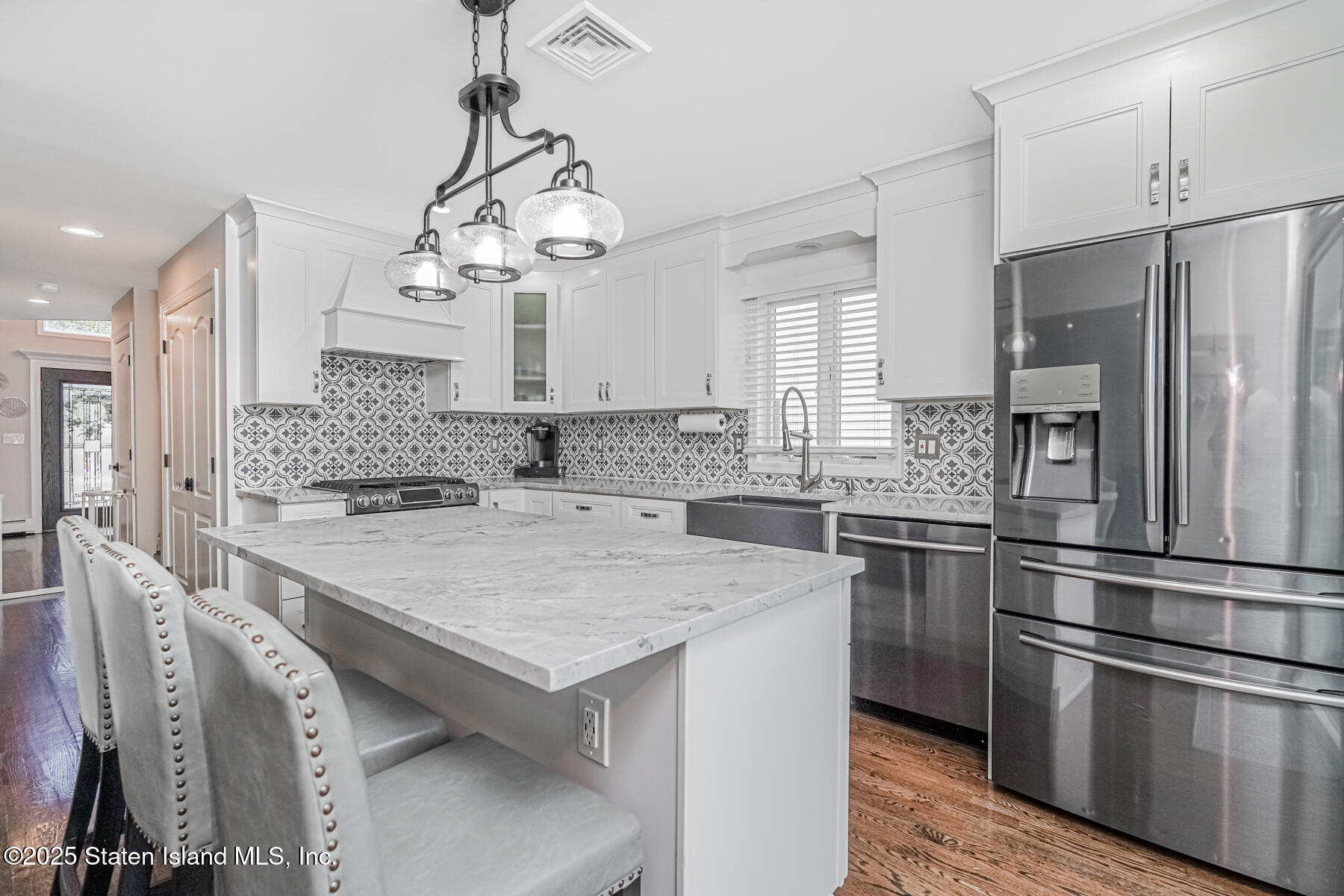 26 Rochelle Place Staten Island, NY 10312 - Photo 19 of 47 a kitchen with stainless steel appliances granite countertop a sink stove and refrigerator