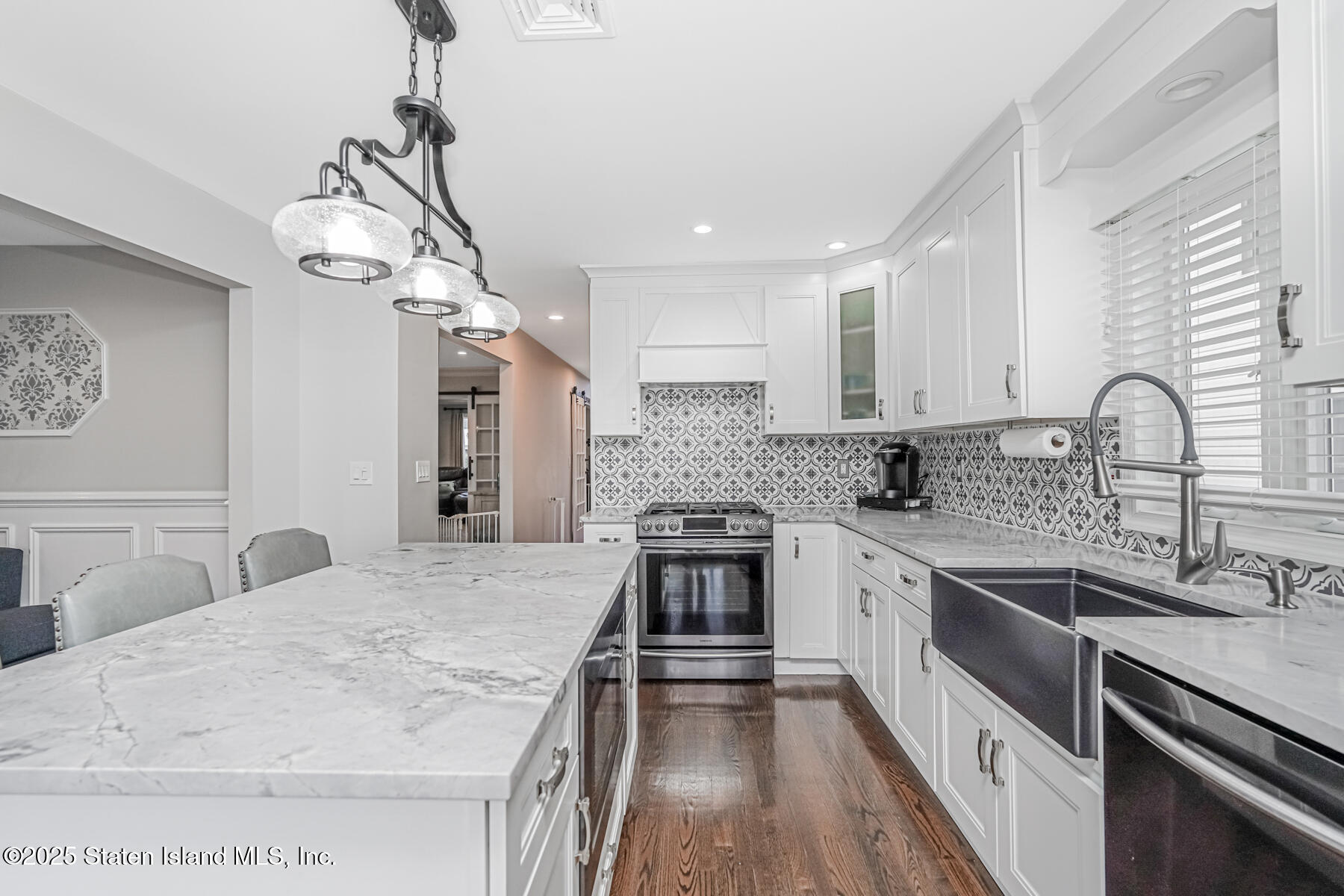 26 Rochelle Place Staten Island, NY 10312 - Photo 20 of 47 a kitchen with a sink stainless steel appliances a counter space and cabinets