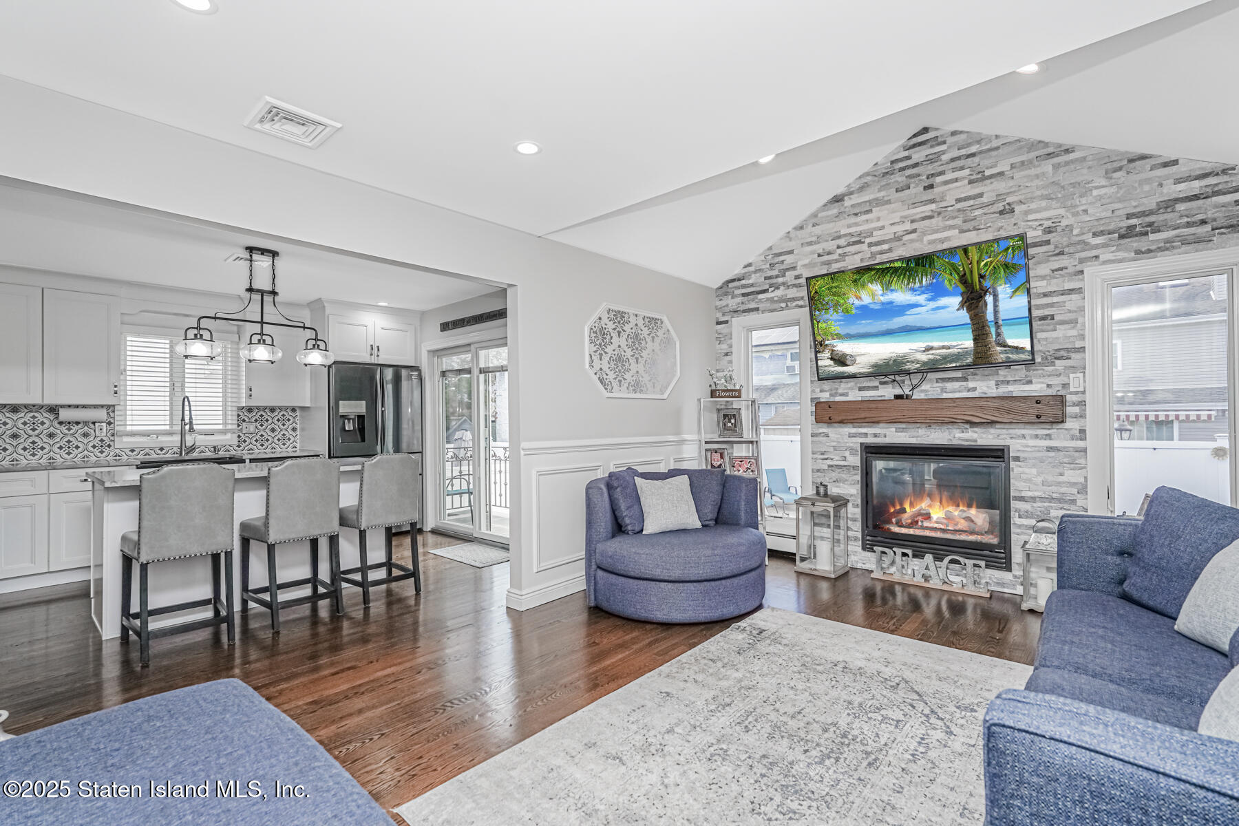 26 Rochelle Place Staten Island, NY 10312 - Photo 22 of 47 a living room with furniture and a fireplace