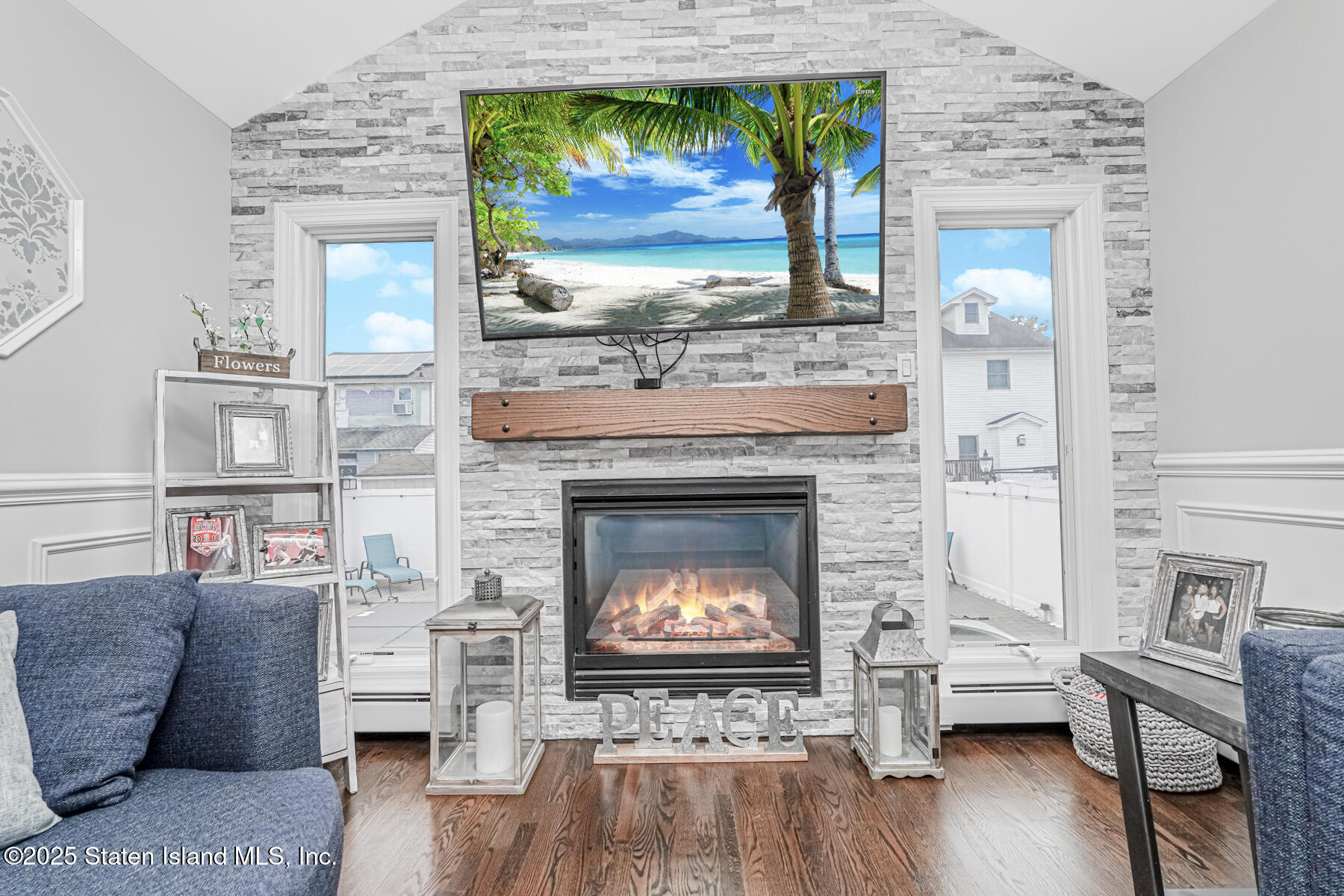 26 Rochelle Place Staten Island, NY 10312 - Photo 23 of 47 a living room with furniture and a fireplace