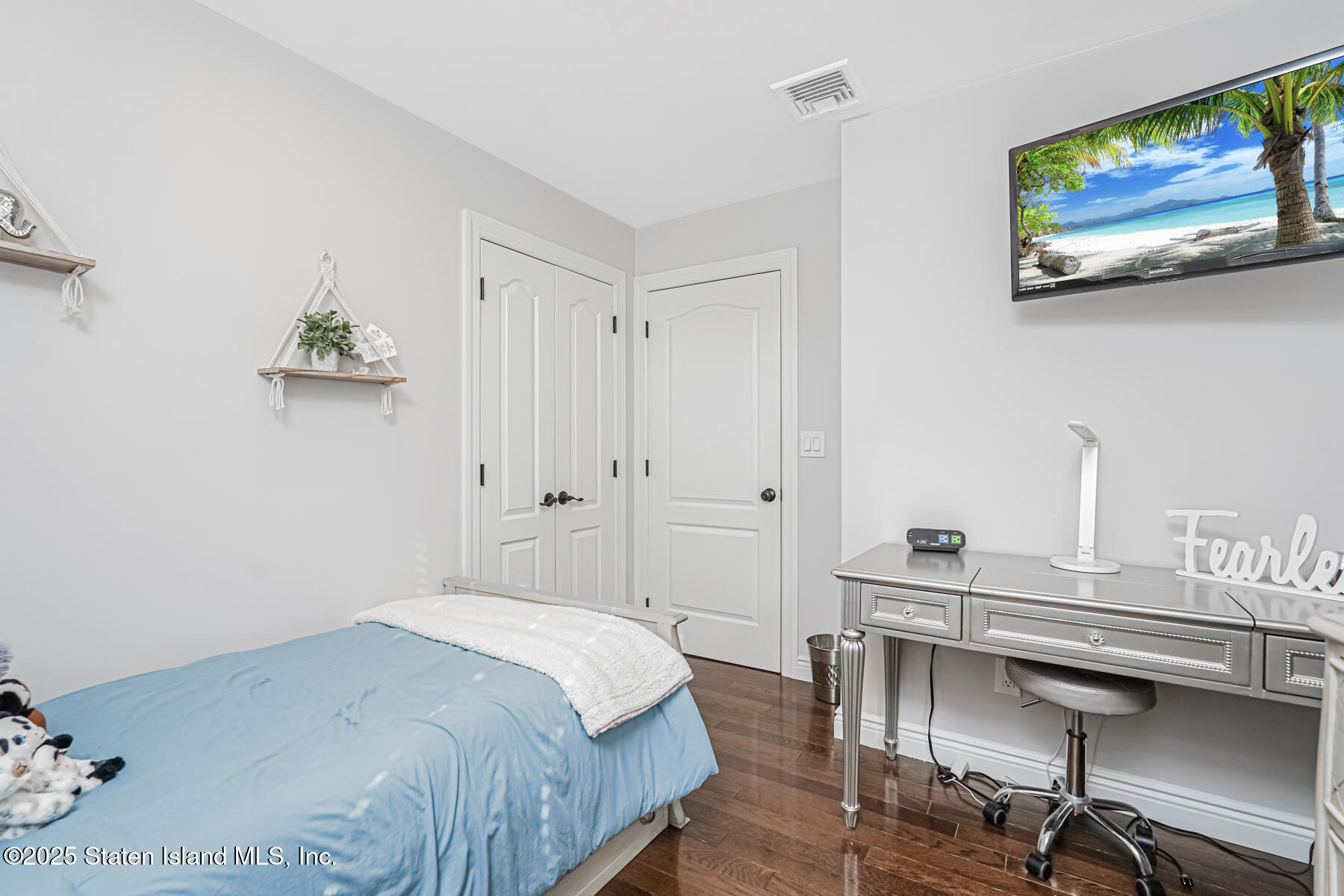 26 Rochelle Place Staten Island, NY 10312 - Photo 28 of 47 a bedroom with a bed and a desk