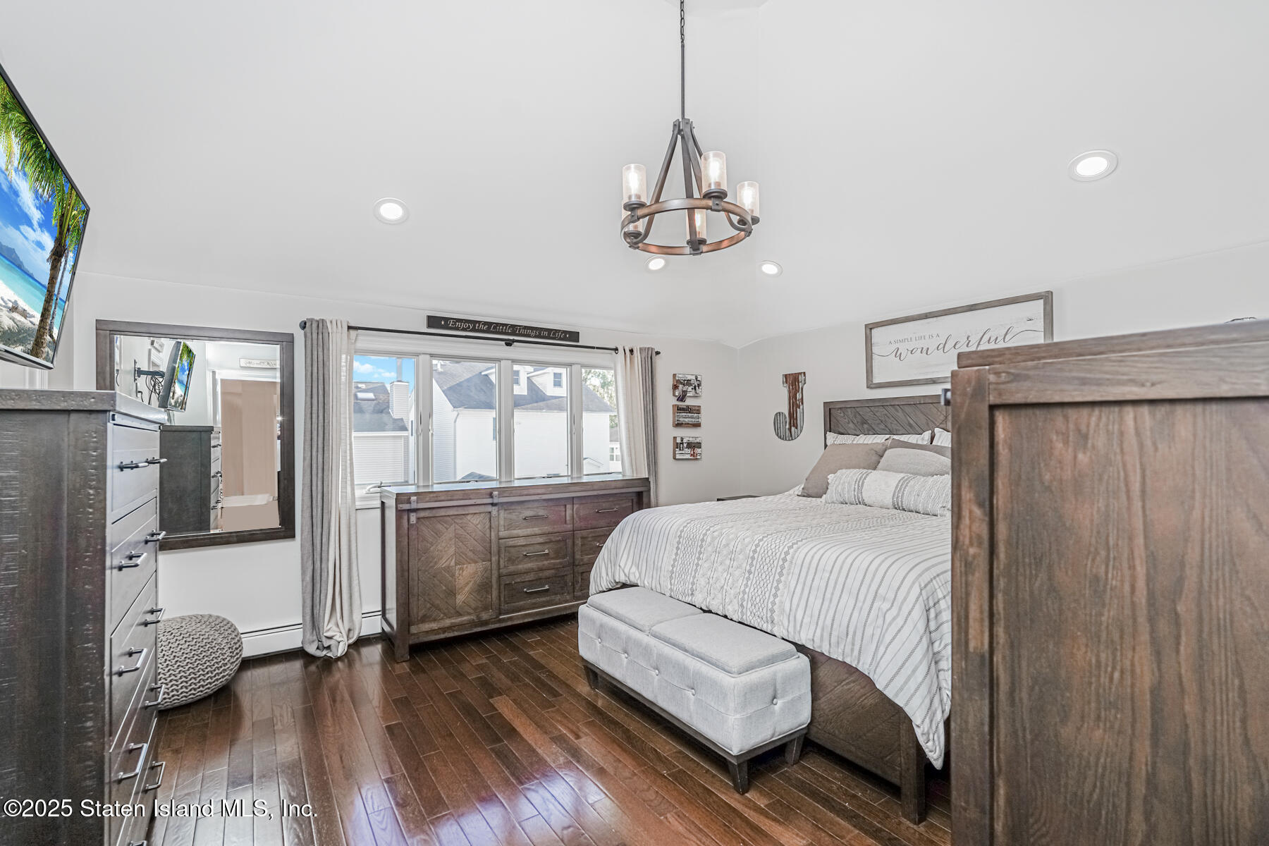 26 Rochelle Place Staten Island, NY 10312 - Photo 30 of 47 a bedroom with a bed and wooden floor