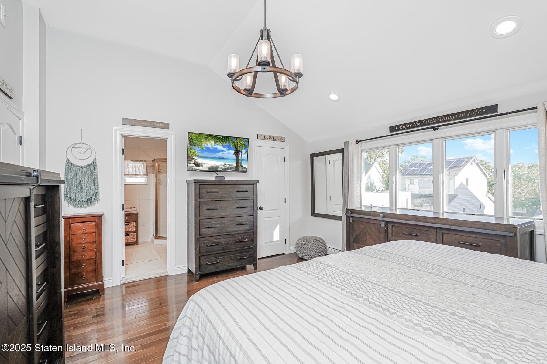 26 Rochelle Place Staten Island, NY 10312 - Photo 32 of 47 a bedroom with a bed and a large window