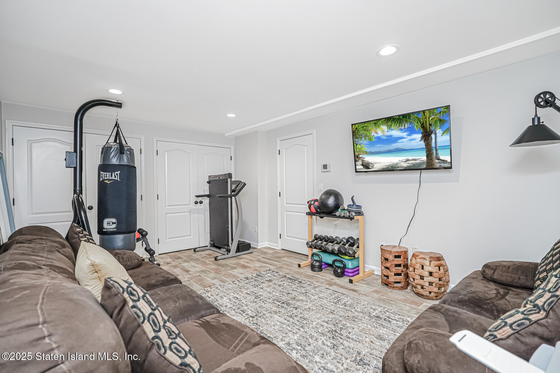 26 Rochelle Place Staten Island, NY 10312 - Photo 36 of 47 a bedroom with bed and a flat screen tv