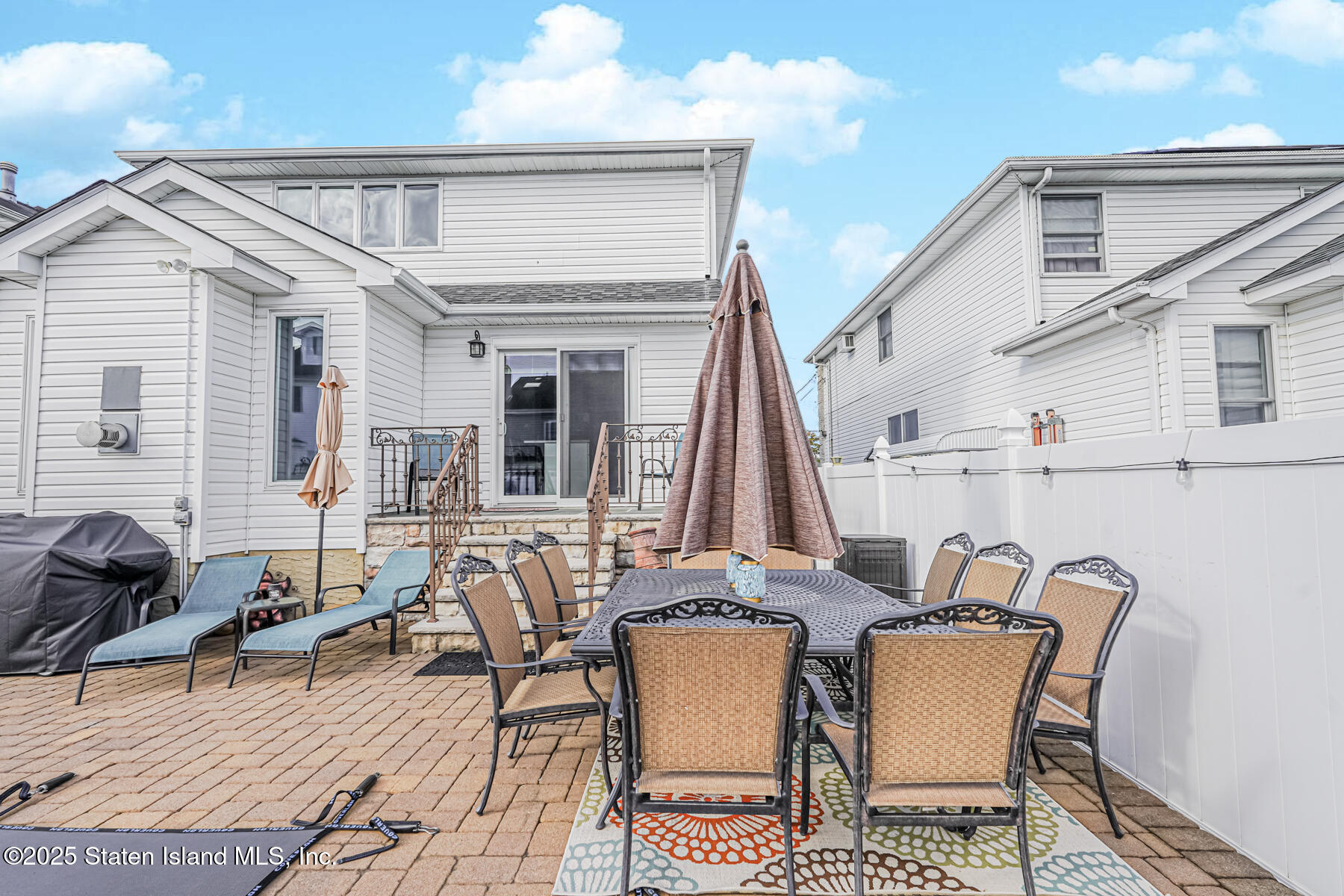 26 Rochelle Place Staten Island, NY 10312 - Photo 43 of 47 a view of a dinning table and chairs in the patio