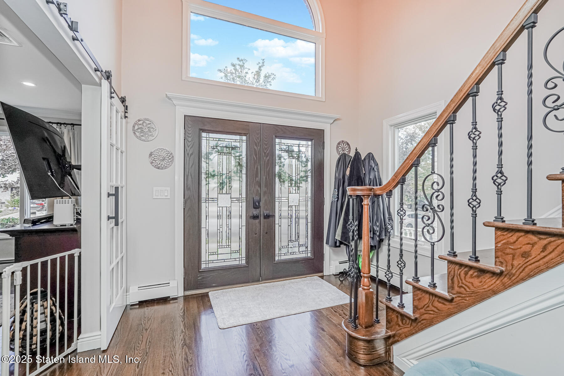 26 Rochelle Place Staten Island, NY 10312 - Photo 8 of 47 a view of front door with wooden floor and stairs