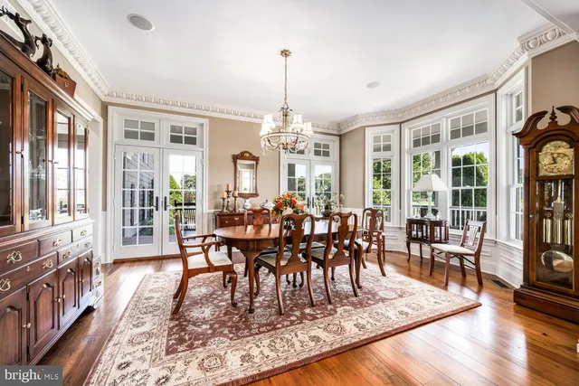a large kitchen with a large window and kitchen island