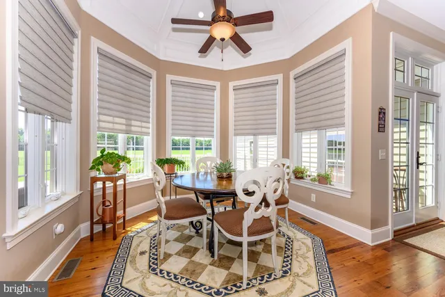 a bathroom with a granite countertop sink toilet a mirror and shower