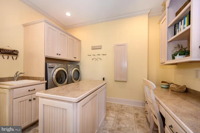 a front view of a house with a yard table and chairs
