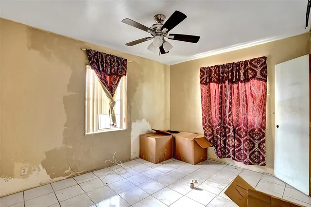 a living room with a couch and a window
