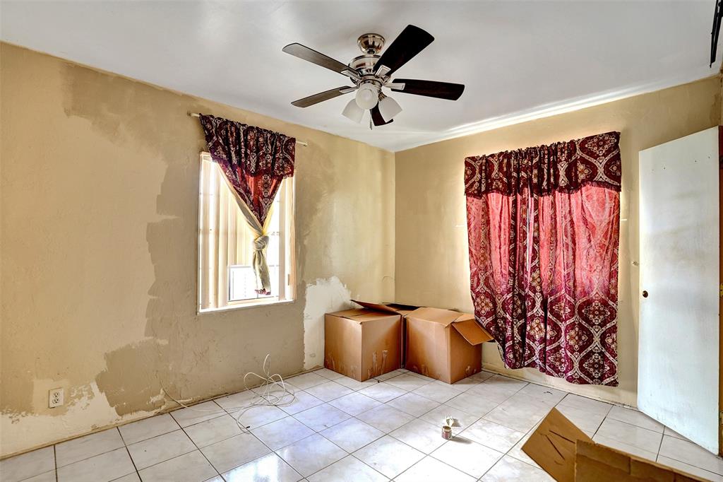 57 Northwest 68th Street Miami, FL 33150 - Photo 22 of 36 a living room with a couch and a window