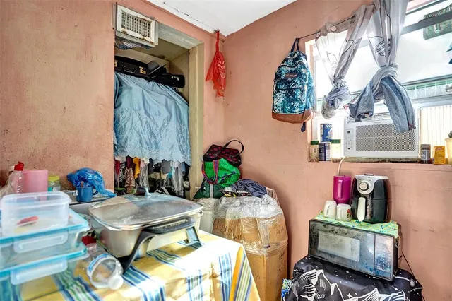 a living room with furniture and a mirror