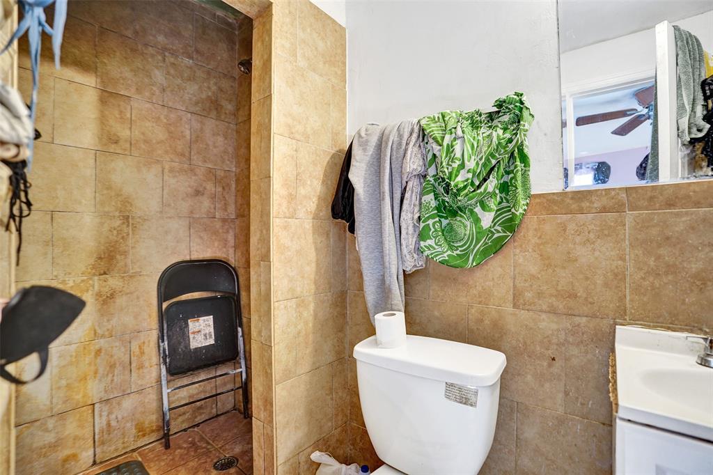 57 Northwest 68th Street Miami, FL 33150 - Photo 29 of 36 a bathroom with a toilet and a sink