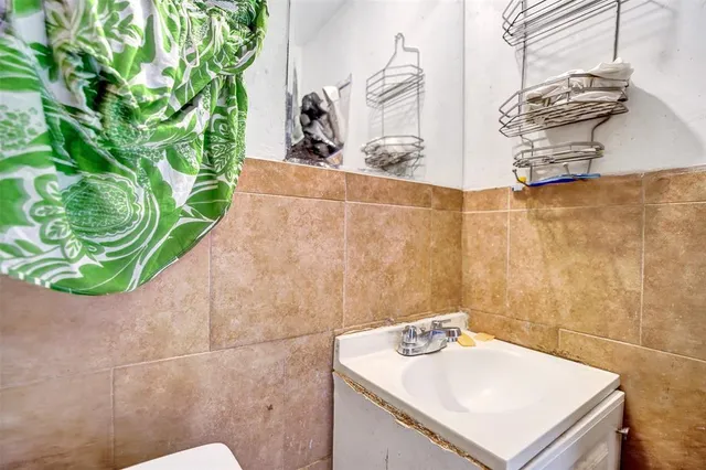 a bathroom with a sink and mirror