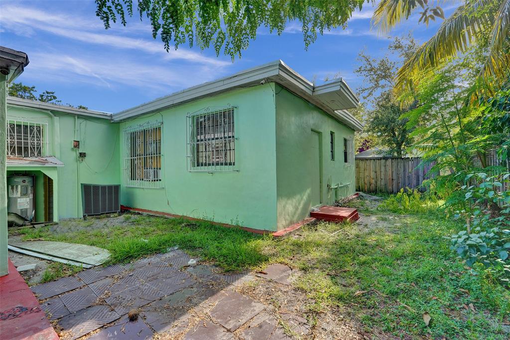57 Northwest 68th Street Miami, FL 33150 - Photo 31 of 36 a front view of a house with garden