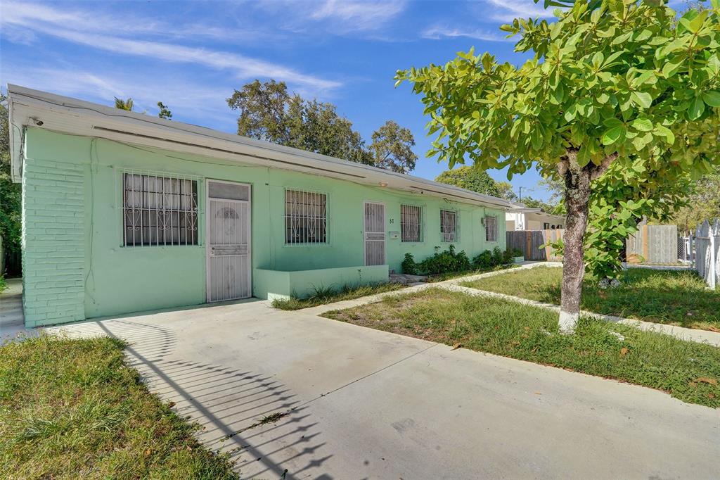 57 Northwest 68th Street Miami, FL 33150 - Photo 35 of 36 front view of a house with a yard