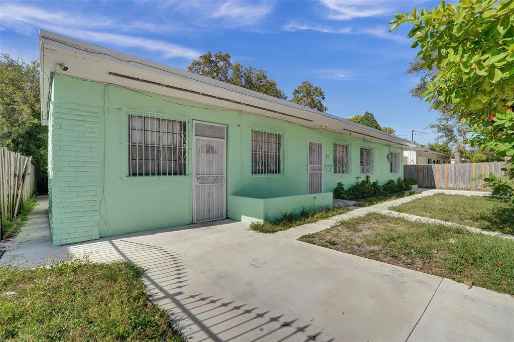 57 Northwest 68th Street Miami, FL 33150 - Photo 36 of 36 a front view of a house with a garden