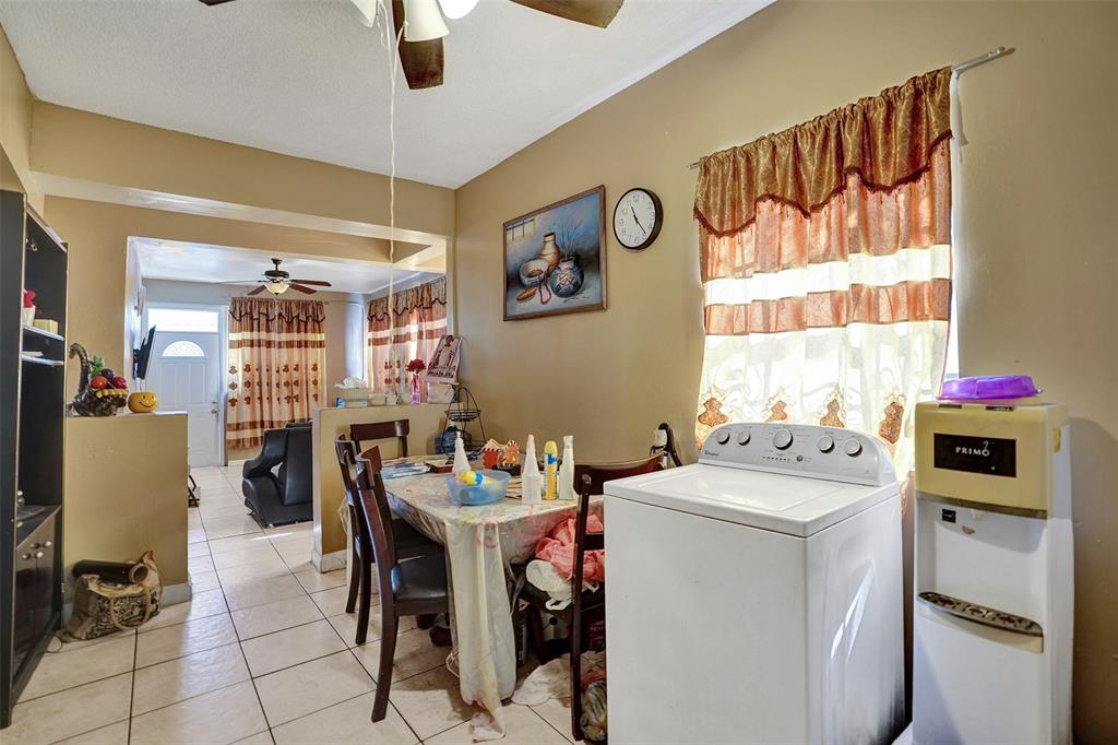57 Northwest 68th Street Miami, FL 33150 - Photo 8 of 36 a utility room with dryer washer and a view of living room