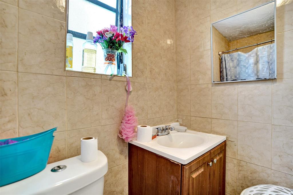 57 Northwest 68th Street Miami, FL 33150 - Photo 10 of 36 a bathroom with a sink and a mirror