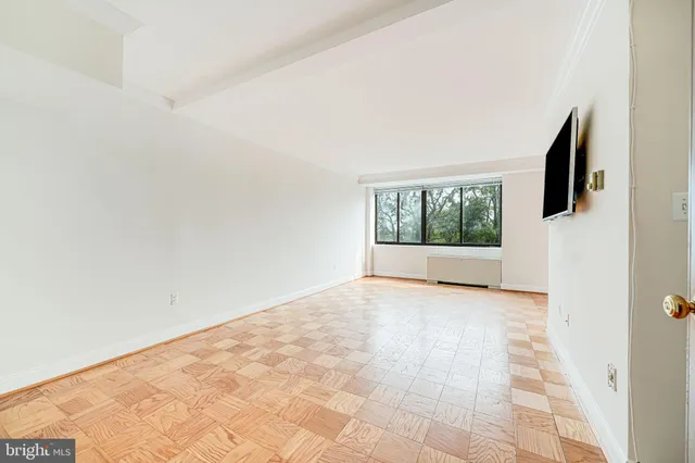 a view of an empty room with a window