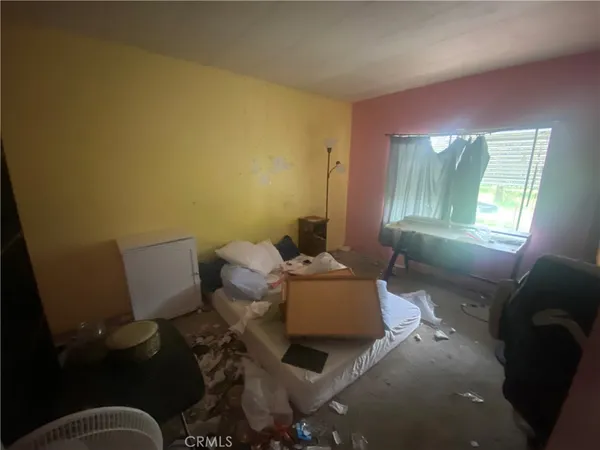 a room with furniture and a window