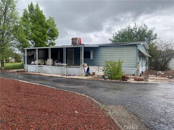 a front view of a house with yard