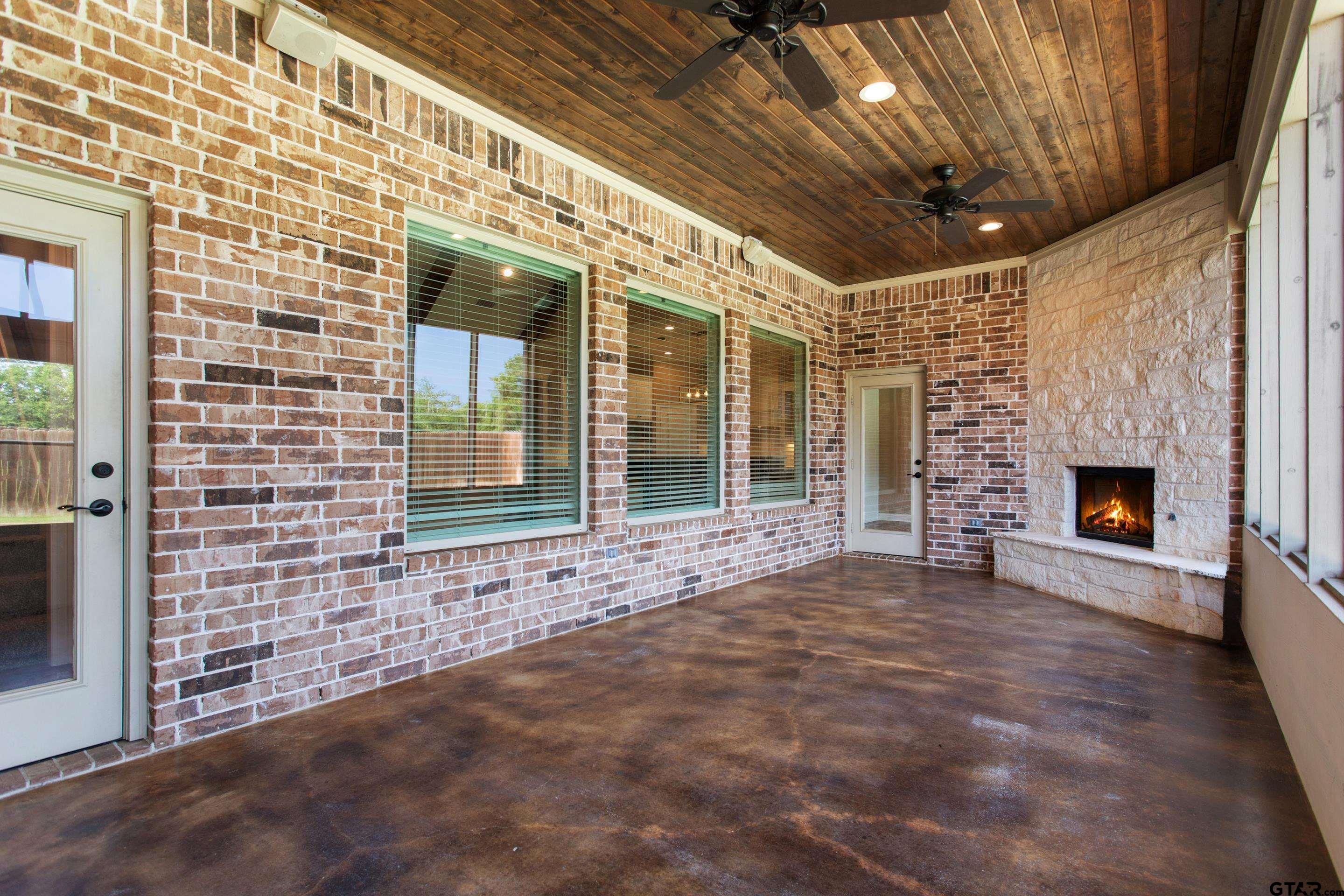 105 Nathan Road Chandler, TX 75758 - Photo 30 of 36 a view of yellow house with a large window