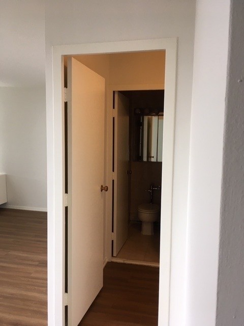 5757 North Sheridan Road, Unit 9G Chicago, IL 60660 - Photo 14 of 16 a view of a hallway with wooden floor