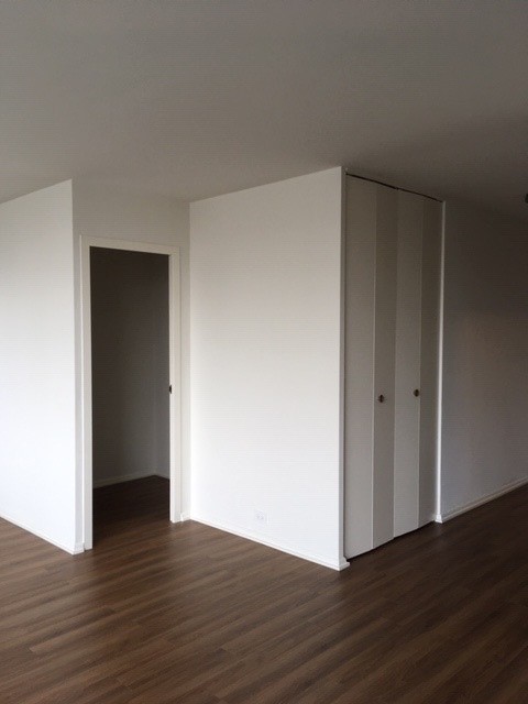 5757 North Sheridan Road, Unit 9G Chicago, IL 60660 - Photo 10 of 16 a view of an empty room with wooden floor