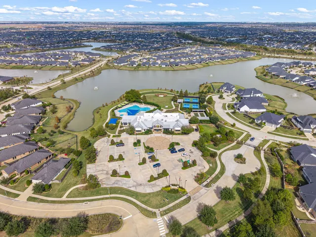 an aerial view of a swimming pool and outdoor space