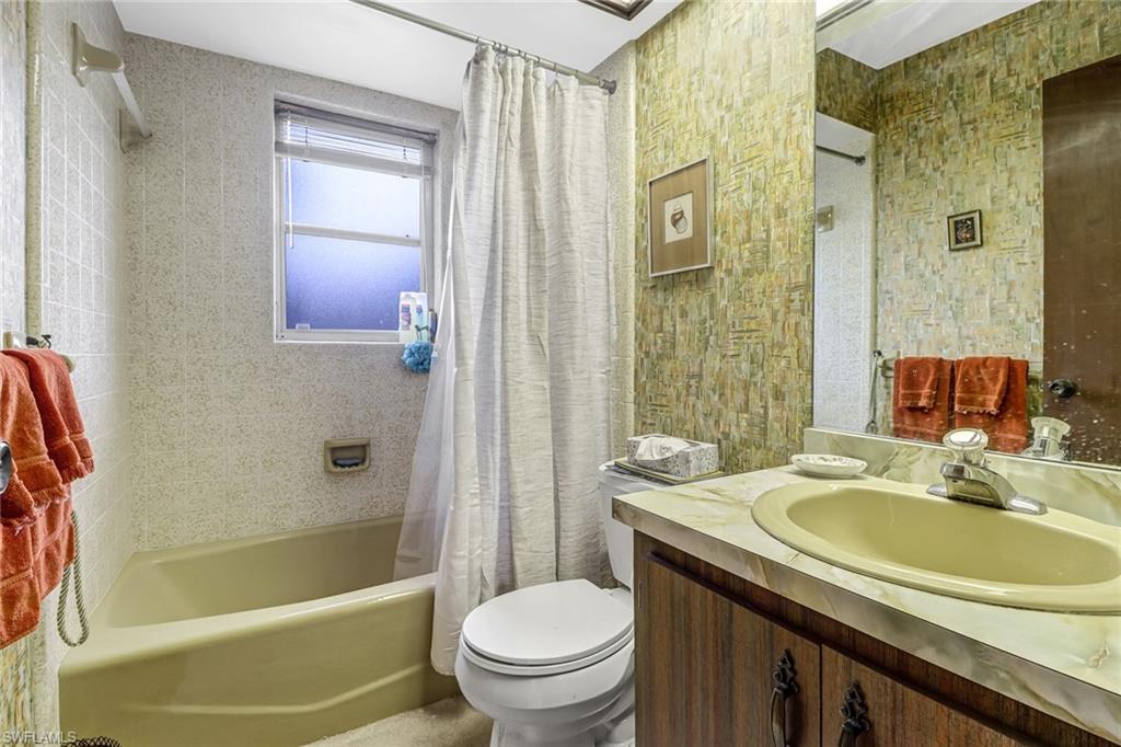 355 Valley Stream Circle Naples, FL 34113 - Photo 20 of 31 a bathroom with a sink toilet and shower