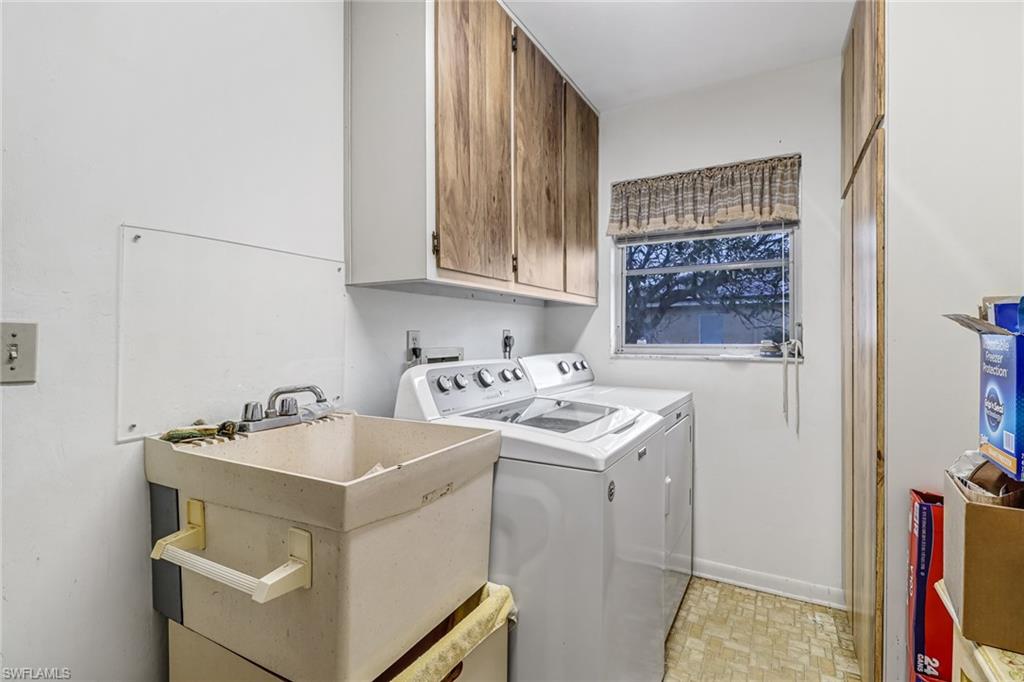 355 Valley Stream Circle Naples, FL 34113 - Photo 21 of 31 a utility room with dryer and washer