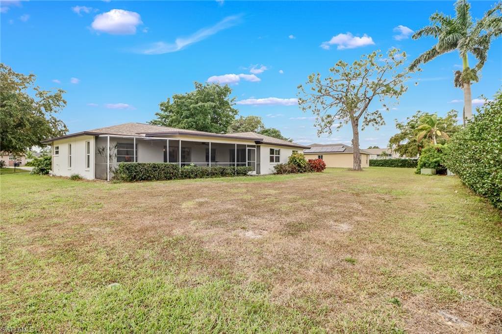 355 Valley Stream Circle Naples, FL 34113 - Photo 25 of 31 a view of a house with a yard