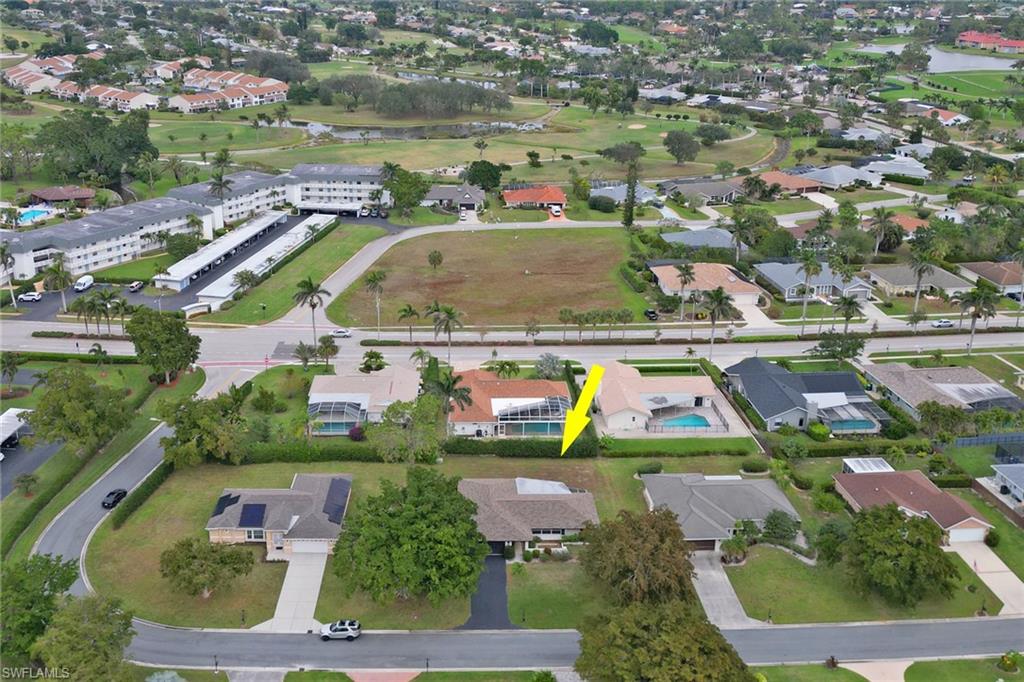 355 Valley Stream Circle Naples, FL 34113 - Photo 28 of 31 an aerial view of residential houses with outdoor space and swimming pool