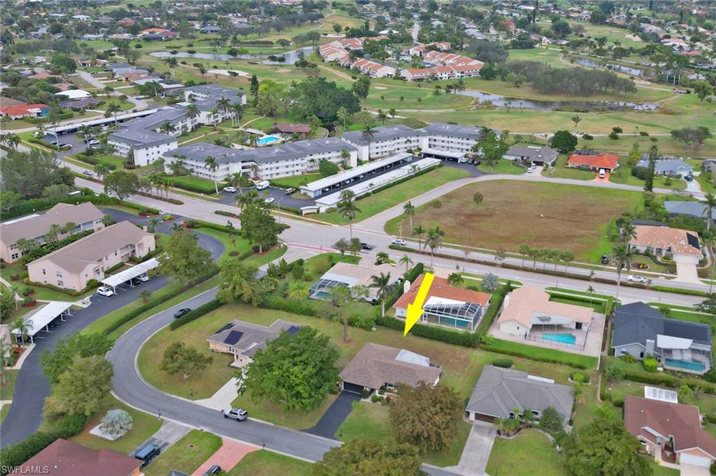 355 Valley Stream Circle Naples, FL 34113 - Photo 29 of 31 an aerial view of residential houses with outdoor space and swimming pool