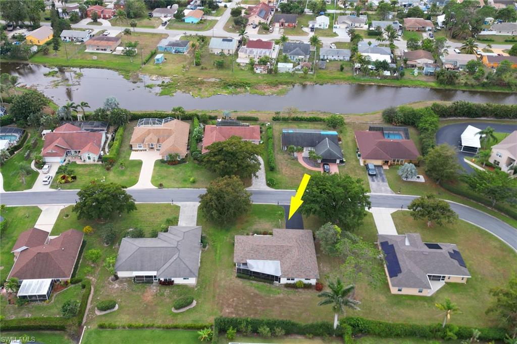355 Valley Stream Circle Naples, FL 34113 - Photo 31 of 31 an aerial view of residential houses with outdoor space
