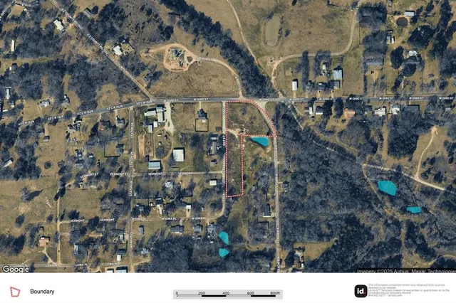 a aerial view of a residential apartment building with a yard