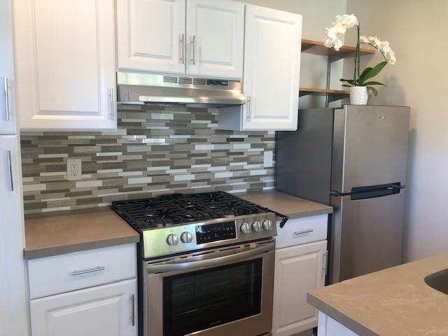 2077 Rebild Drive Solvang, CA 93463 - Photo 3 of 12 a kitchen with a stove and a refrigerator