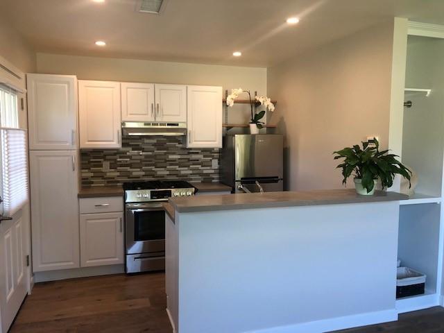 2077 Rebild Drive Solvang, CA 93463 - Photo 4 of 12 a kitchen with stainless steel appliances a sink stove and refrigerator