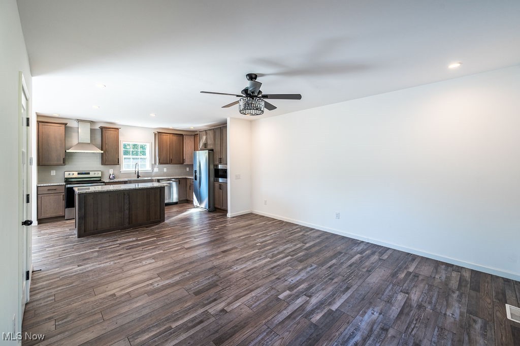 7343 Lost Pavement Road Belleville, WV 26133 - Photo 47 of 49 Kitchen with open floor plan, a center island, recessed lighting, appliances with stainless steel finishes, and dark wood finished floors