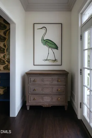 a view of closet with wooden floor